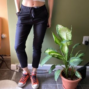 Levi’s black pants with double size red stripes